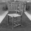 Interior, detail of original rush seated nave chair