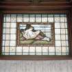 Interior, view of ground floor library figurative stained glass window
