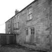 View of rear of main house from NW