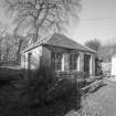 View of outbuilding from E