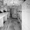 Interior. Basement View of vaulted wine cellar with brick bins from SW