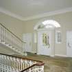 Interior. Ground floor View of entrance hall from NW showing staircase and front door