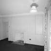 Interior. Ground floor View of Ante room in E wing from W showing 18th century fireplace and panelling