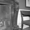 Interior. Meeting room, fireplace, detail of volute forming upright