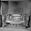 Interior. Meeting room, fireplace, detail of grate