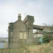 View from ESE of E side of pump house, with aqueduct behind