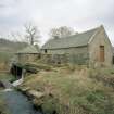 View from SW along W side of mill, showing lade and water wheel