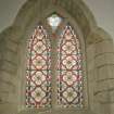 Interior. Detail of 2-light pointed arch stained glass window