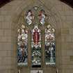 Interior. Chancel. Detail of stained glass 3-light pointed arch window to E gable