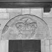 Interior. Chancel. Detail of 17th century carved tympanum above door at N