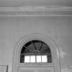 Interior, detail of fanlight over Southwest entrance