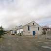 View of E end of former creamery from SE