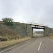 General view of railway bridge from NW, showing granite abutments and single steel truss