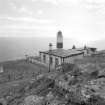 View from N looking down onto lighthouse compound, with keepers' house in foreground