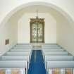 Interior. View from SSE showing N aisle with stained glass window