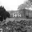 General view from E across garden showing setting.