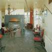 Interior.
Willie Wastle's bar, view from S showing circular fireplace and original 1930's 'Swiss' furniture.