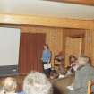 RCAHMS Muck Survey. Angela Gannon giving a talk on the archaeology of the Small Isles in Port Mor House.