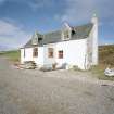 Muck, Port Mor, Pier Cottage. Cottage and gear store. View from SSW.