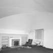Interior, view of vaulted basement original kitchen now with marble fireplace
