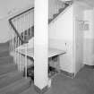 Interior, view of staircase at basement level