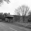 General view from SW of mill at road level, with kiln in background