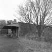 Oblique view from SSW, showing part of SW side of mill, and awning over loading bay