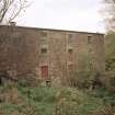 View from SW of SW side of mill, revealing that, despite its modest appearance from the road, it is four storeys high