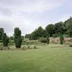 View of garden from SE showing gardeners house and glasshouses beyond