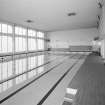Interior. P.E. /Technical / Youth club wing. View of swimming pool from NW