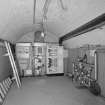 Interior. Basement. View of S wing vaulted store from N showing new electrics