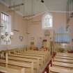 Interior.
View from SE showing pews, organ and communion table.