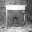 Interior. Basement. Detail of fireplace in West corner room