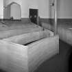 Interior. 
Detail of curved box pews.