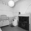 Interior. View of kitchen from South East showing bell board, dresser and range