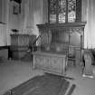 Interior. View showing Communion Table, War Memorial Screen and Pulpit by P R McLaren 1922.