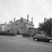 View of original manse from North West and link block to church