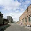 View from E showing Broadloom Department (right), and packing, finishing and disused office block (left)