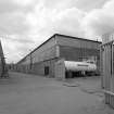 View from N of E side of Wire Division's South Mill, in which the foundry and annealing departments are located.  This unit produces rod, which is then taken to the North Mill to be drawn into wire