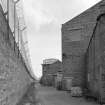 View from SW along N side of Wire Division's North Mill, also showing water tank