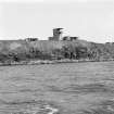 View from SW in Switha Sound of World War II twin 6-pounder gun-emplacement with Battery Observation Post and one of the single 12-pounder gun-emplacements.