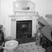 Interior. 
Detail of fireplace and toilet seat in upstairs room.