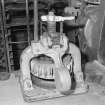 Interior. 
Detail of dough cutting machine, used to produce pieces of dough of a uniform size for batch baking.