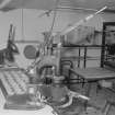 Interior. 
View of Scotch-pie-crust moulding machine in the pie-crust gallery with a tray of completed crusts.