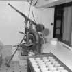 Interior. 
Detail of Scotch pie crust moulding machine in the pie-crust gallery with a tray of completed crusts.