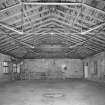 Interior. Top flat, view of E end of mill, showing hipped roof and light wrought-iron roof trusses