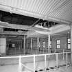 Interior. 4th floor, view showing cast-iron frame and concrete and corrugated-iron structure where a section of ceiling has been cut away