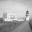 General view of lighthouse, keepers' house and compound from SW