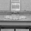 Janitor's house, carved cartouche style panel, detail