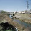 General view of Lambhill Bridge and Forth and Clyde Canal with towpath from E showing Skirsa Street housing